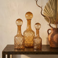 Bouteille Cianna — Marron Verre Rond avec Boule S