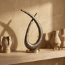 Kayen Gold alu loop shaped statue rustic finish