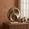 Deuie Brass casted alu statue travertine base